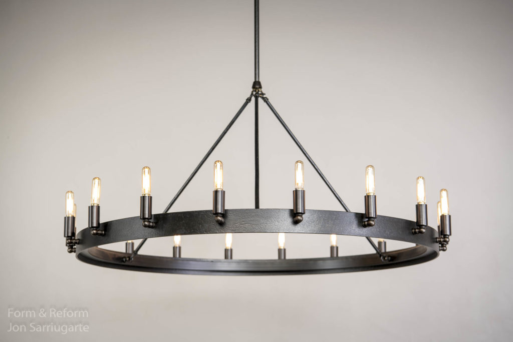 I made this light for my mother in law Jackie Mate. She wanted to replace the over the top scrolled wrought iron fixture that came with their new home. I had made her a light for her last home and the new owner insisted it stay with the home. It needed to fit with the other iron fixture but stay simple. Borrowing from the lights I did for Harvard, the RH hit Camino and Gioa with came up with our new light Mate. Looking forward to holiday meals under this light! https://formandreform.com/mate-36/